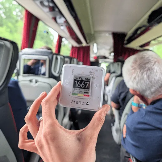 An Aranet4 showing 1667 ppm in a bus.